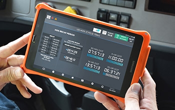 A truck driver using an Electronic Logging Device.