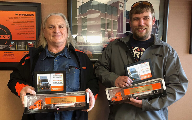 Schneider Team of the Year drivers pose with awards,