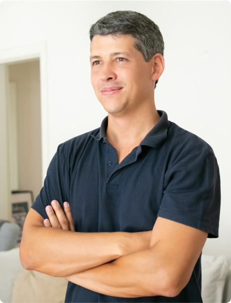 man-with-arms-crossed-smiling.png
