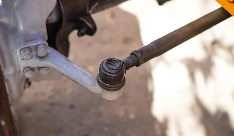 Close-up of steering linkage and tie rod end.