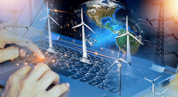 Collage of a laptop, wind turbines, electric transmission towers and a globe