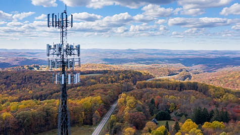 Telecommunications tower above a rural landscape