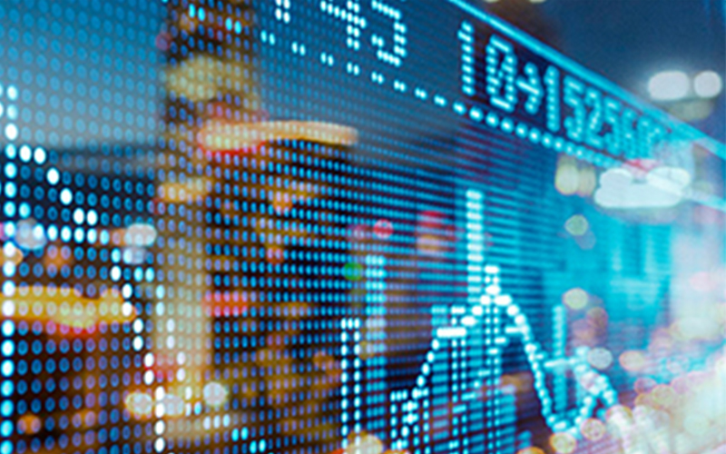 digital representations of stock market activity with a city scape reflection