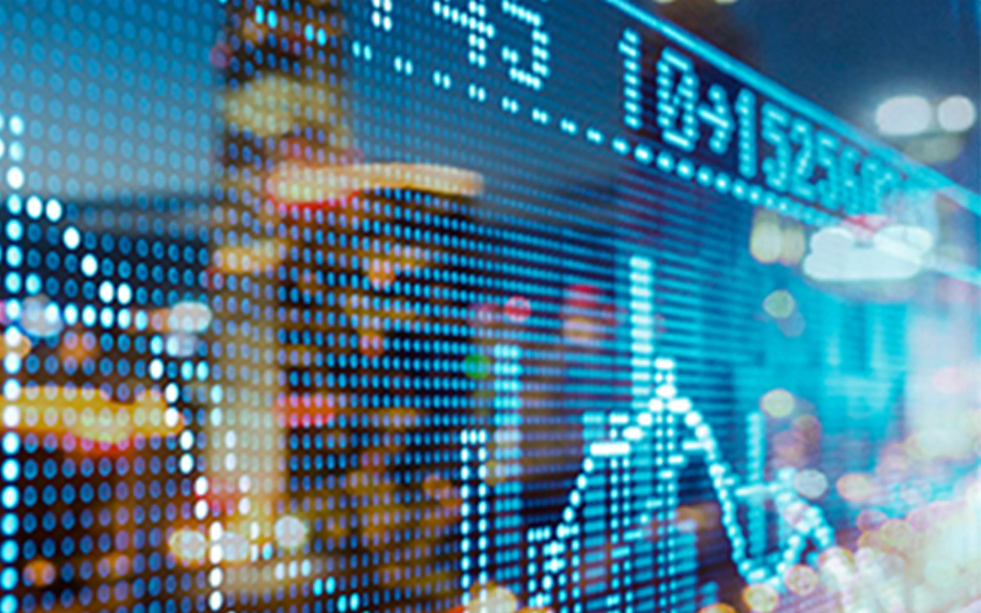 digital representations of stock market activity with a city scape reflection
