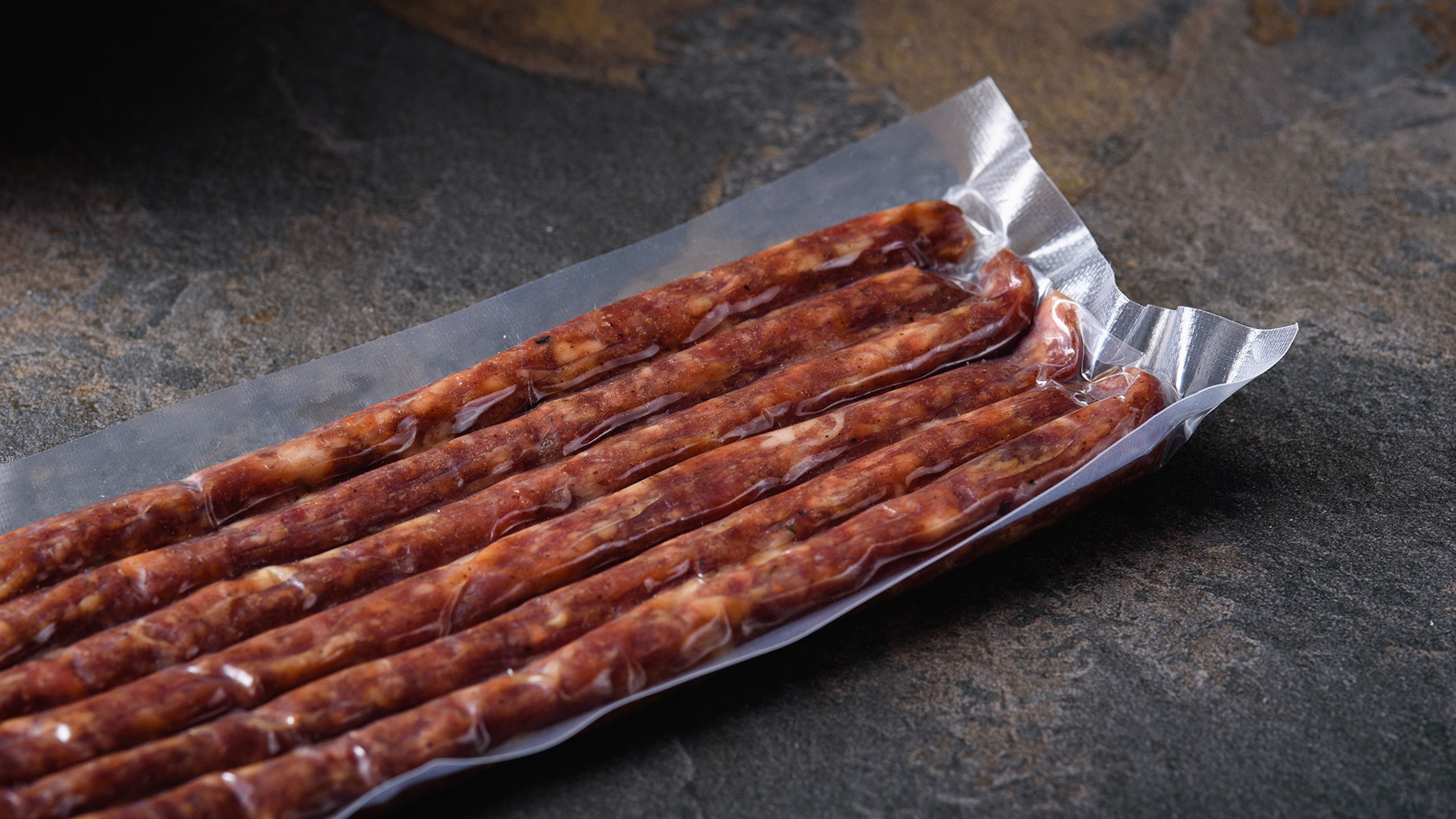 Smoked sausages in vacuum-sealed packaging