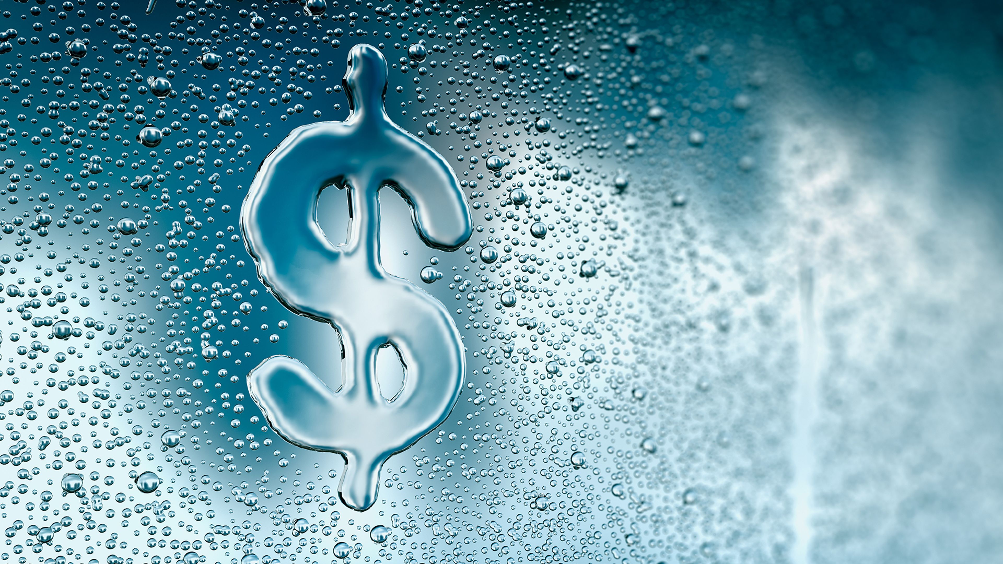 Photo of a dollar sign written in water drops