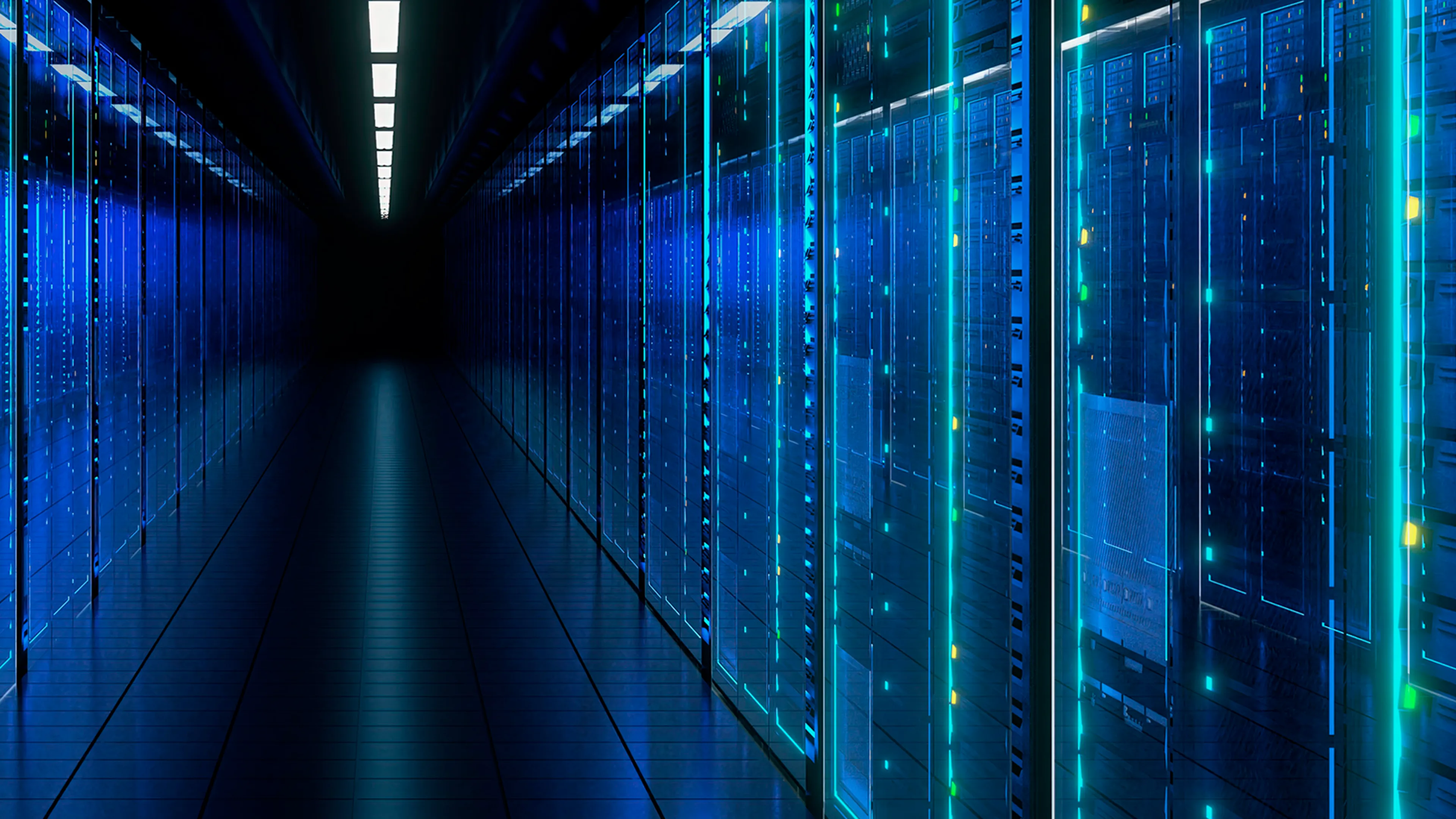Interior view of a data center corridor with rows of server racks and blue lighting reflecting off polished floors, showing cables and equipment along both sides