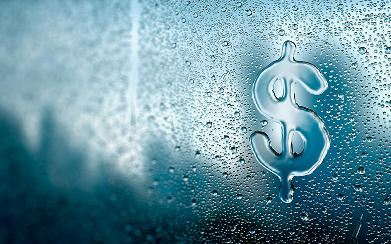 Dollar sign created out of water droplets