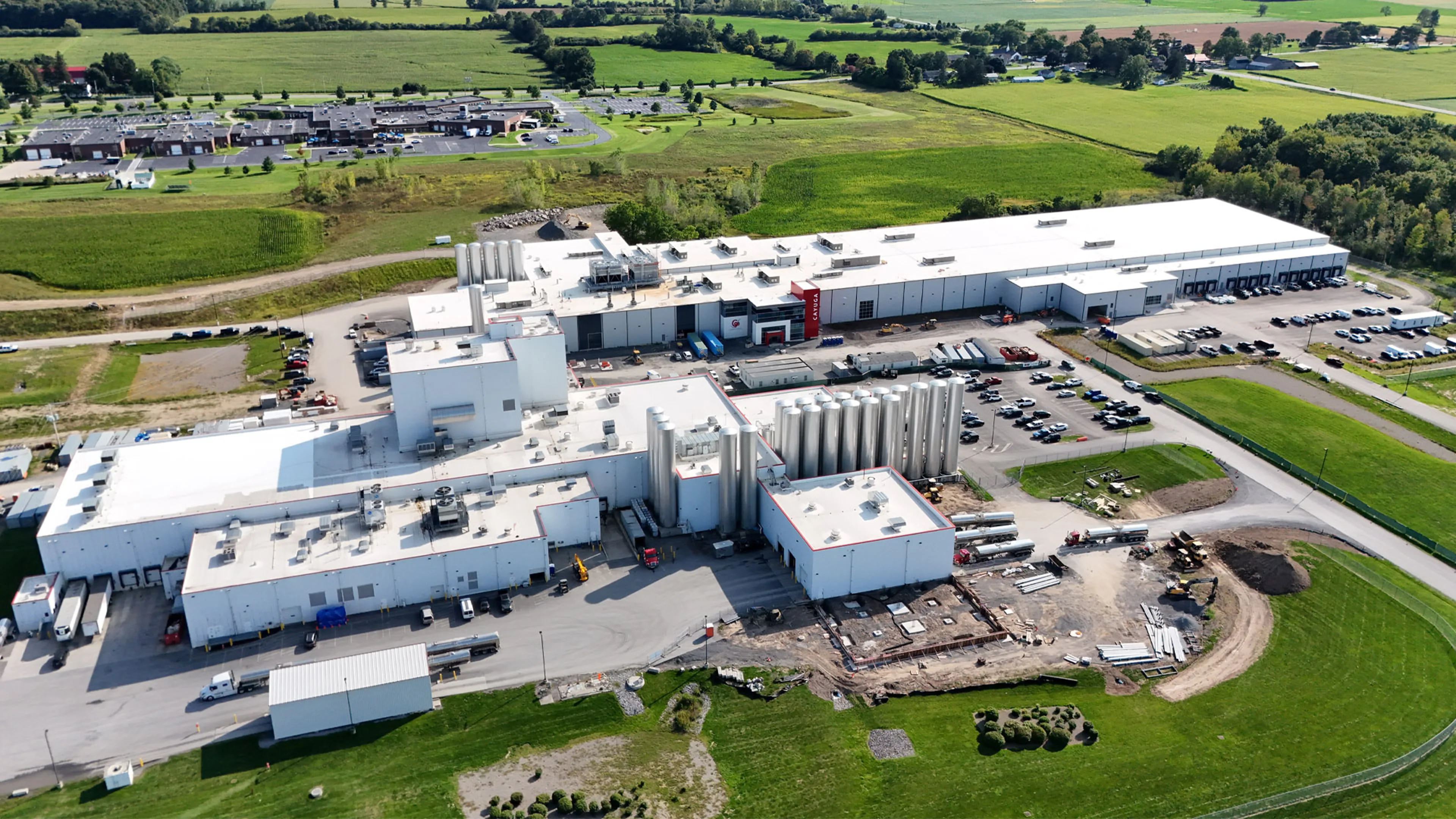 Aerial view of a dairy surrounded by farmland.