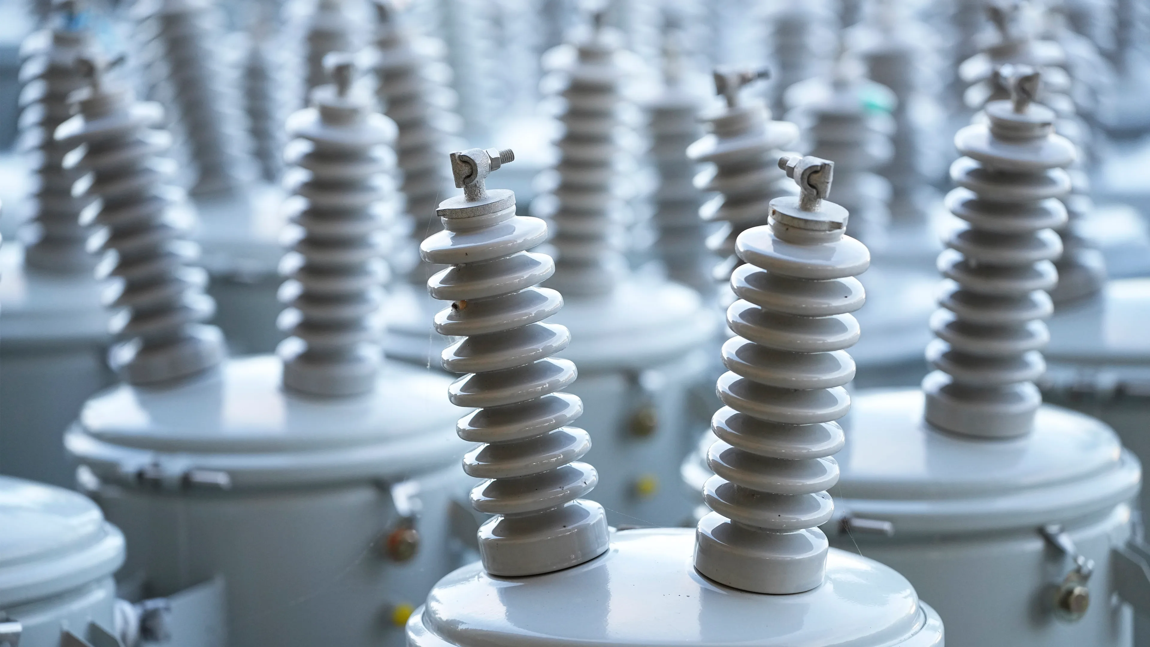Close-up of electrical insulators and utility equipment used in power distribution systems