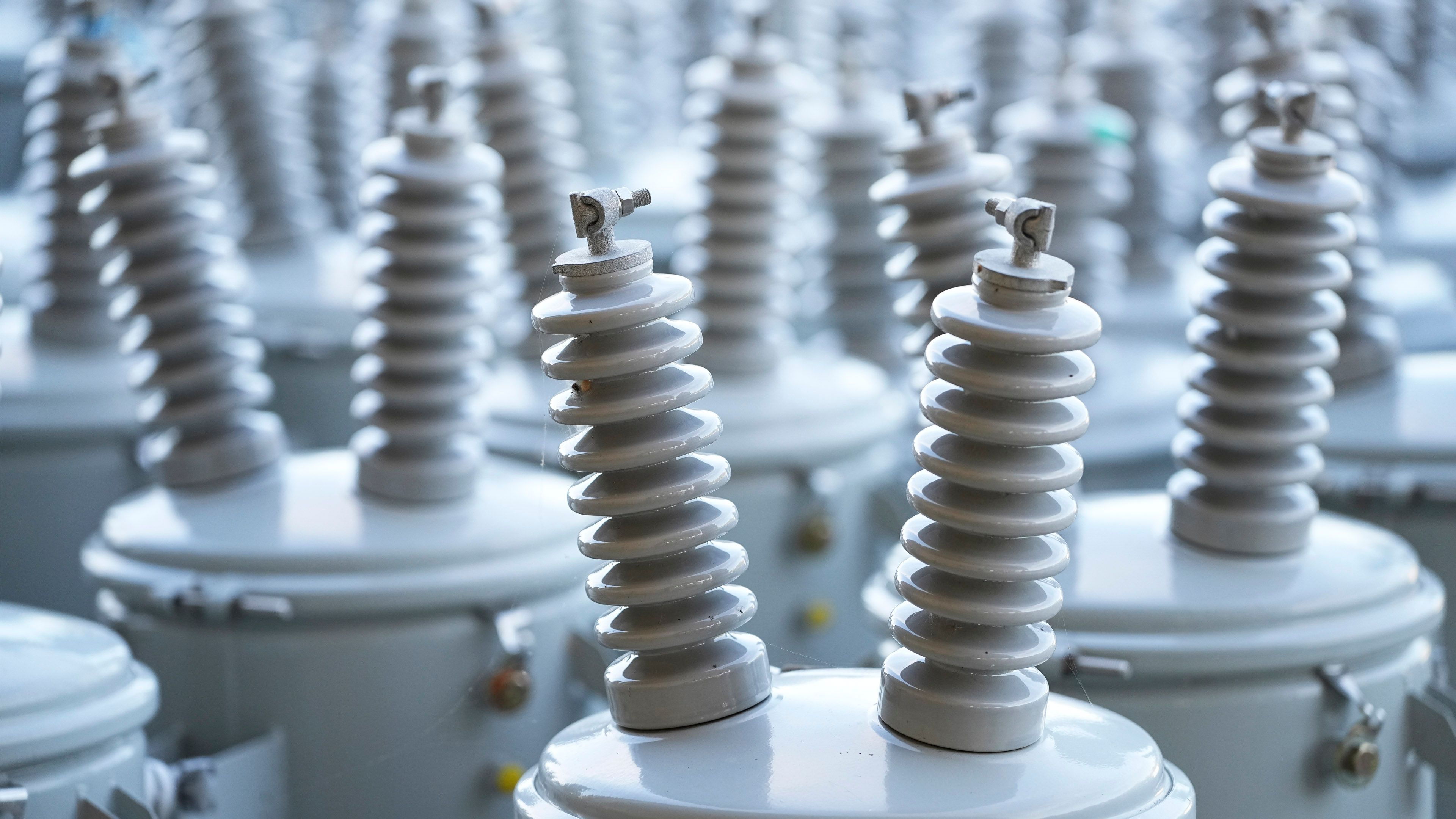 Close-up of electrical insulators and utility equipment used in power distribution systems