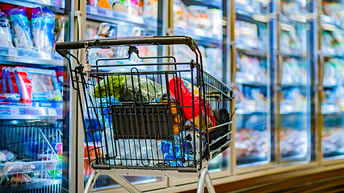 Shopping cart in the freezer ailse at a supermarket