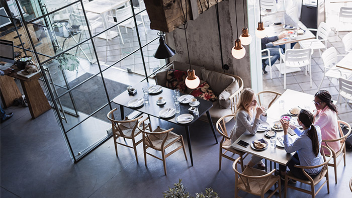 Interior overhead view of a restaurant with patrons at tables