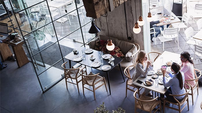 Interior overhead view of a restaurant with patrons at tables