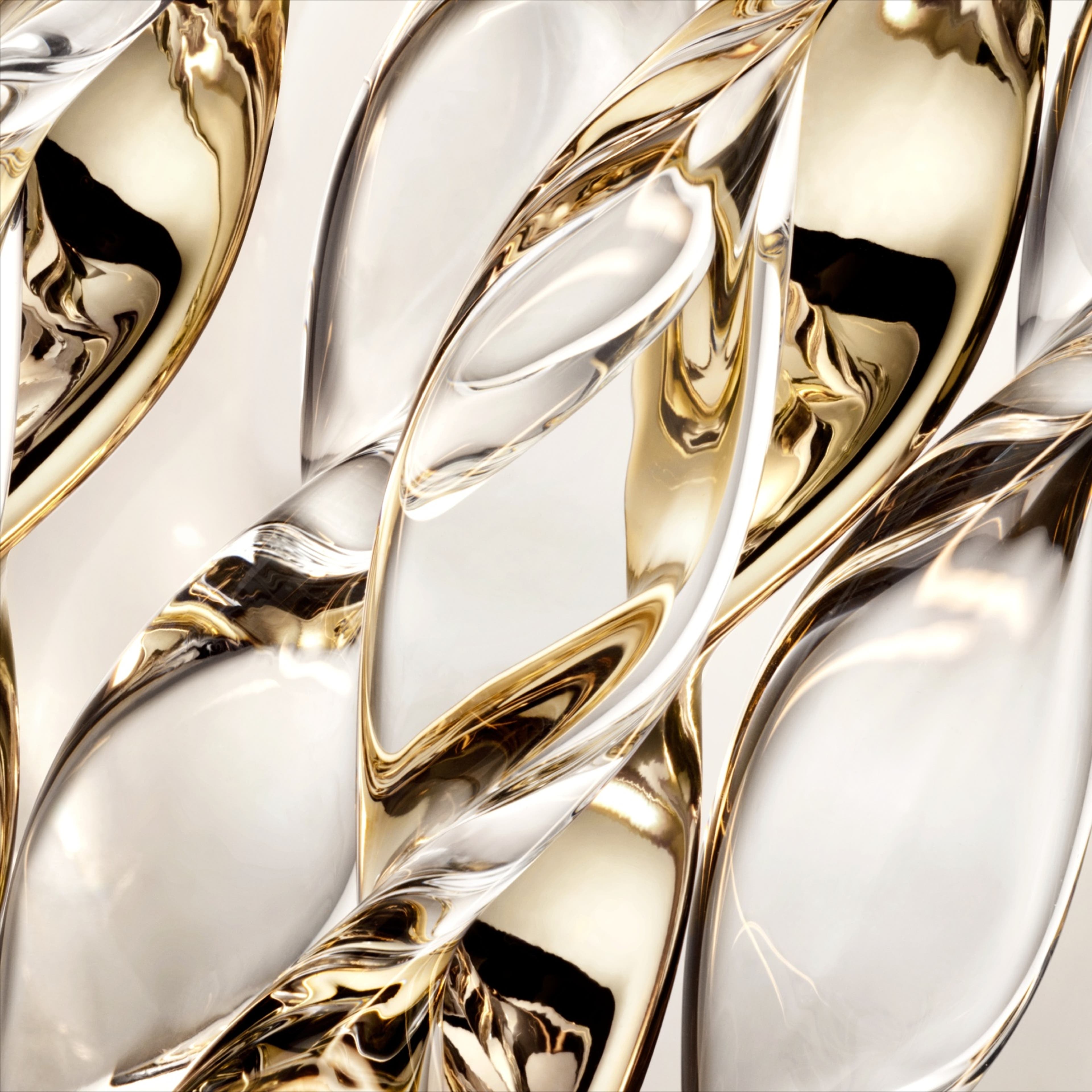 Abstract swirls of metallic gold and silver on a gray background