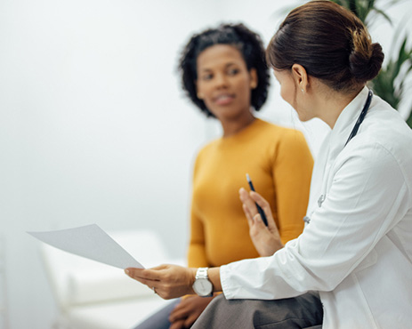 Physician and patient looking at guidance documents