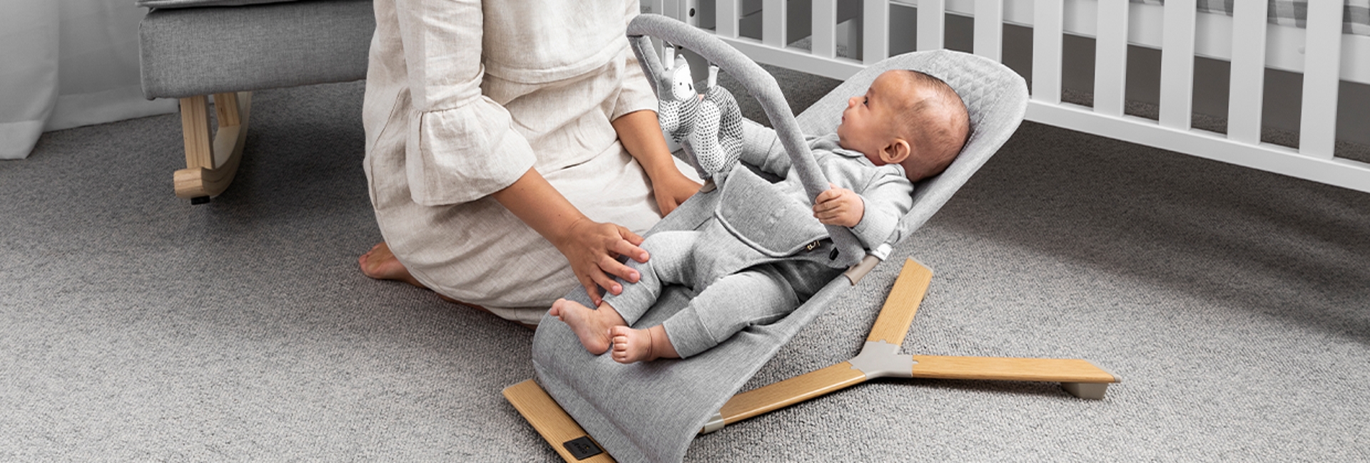 Mum with child in a Jengo Relax Bouncer