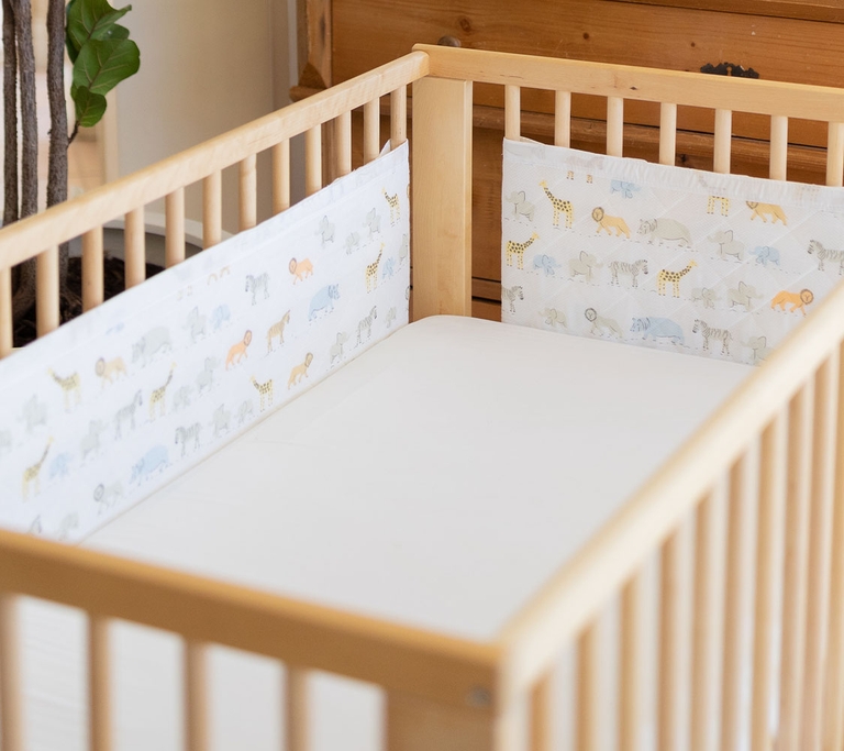 Airwrap product around natural coloured cot 