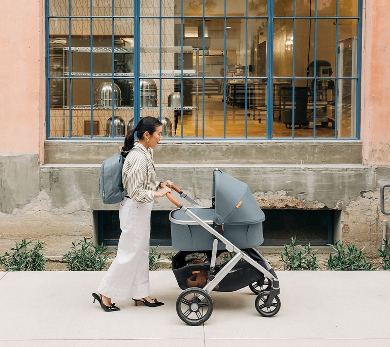 Mother pushing an UPPAbaby pram