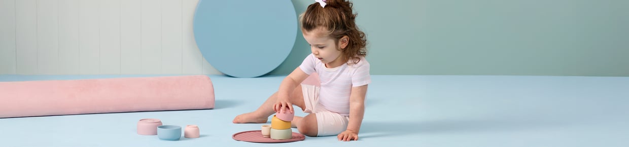 Mother with young child in 4Baby Romper