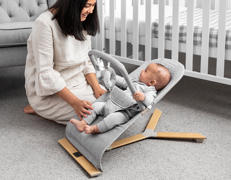 Mum with child in a Jengo Relax Bouncer