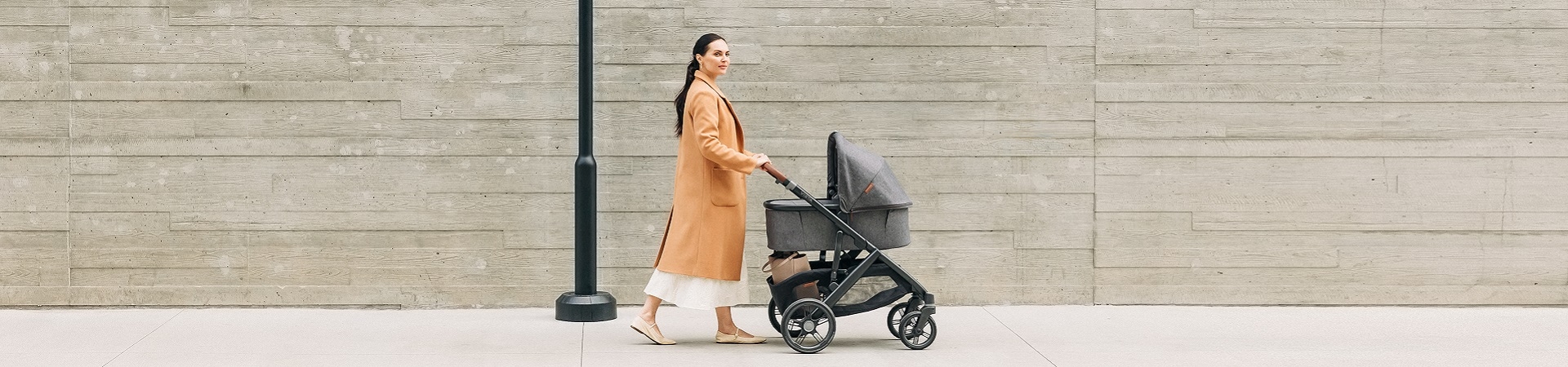 Mother pushing an UPPAbaby pram