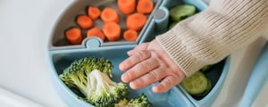 Toddler reaching for broccoli 