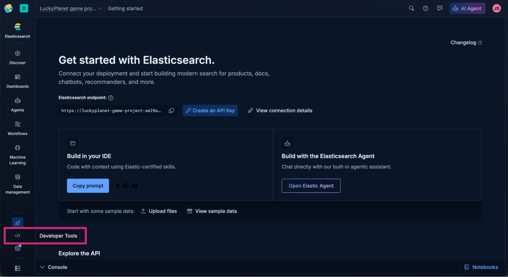 Screenshot of the “Getting started” page in Elasticsearch, showing connection setup options for deployments and API keys. The interface includes panels for building in an IDE or with the Elasticsearch Agent, sample data upload buttons, and a dark sidebar with navigation items. The focus is on "Developer Tools."