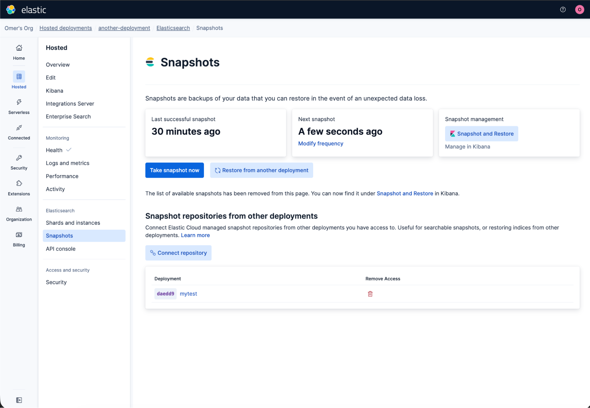 Elastic Cloud dashboard showing the Snapshots page under Elasticsearch. The interface lists snapshot timing details, management options, and repository connections. Buttons for taking and restoring snapshots are visible, along with a table showing one connected deployment labeled “mytest.”