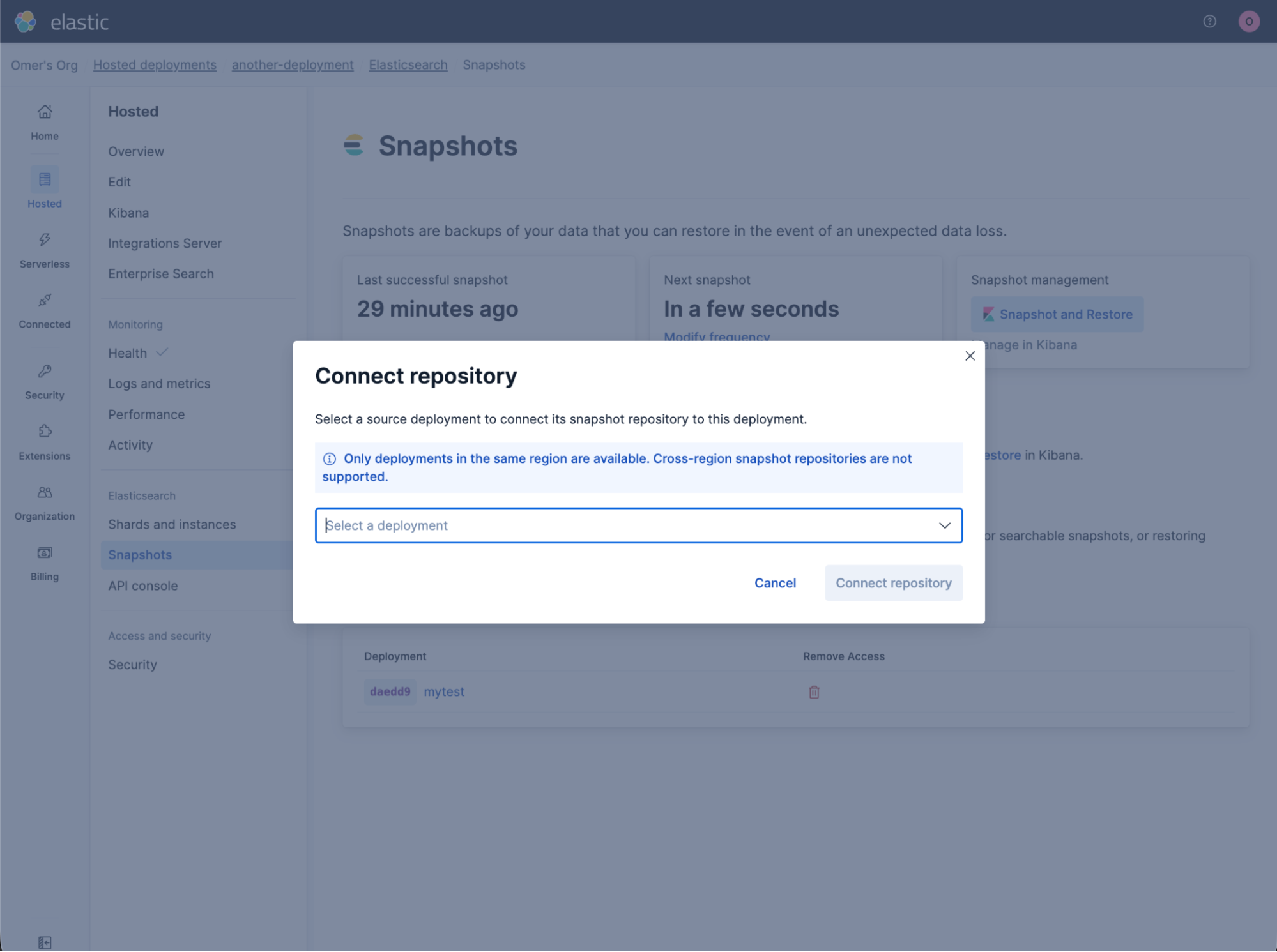 Elastic Cloud interface showing the Snapshots page with a modal titled “Connect repository.” The modal includes a line: "Select a source deployment to connect its snapshot repository to this deployment." And the modal has a dropdown labeled “Select a deployment,” a note stating that only same‑region deployments are supported, and buttons for Cancel and Connect repository.