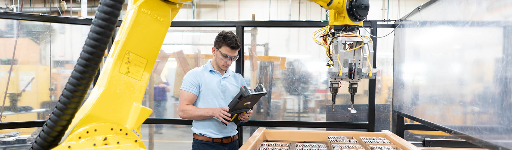 an engineer is working on a robotic apparatus