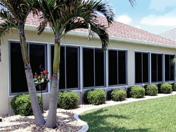 a wall of acrylic windows on a coastal sunroom