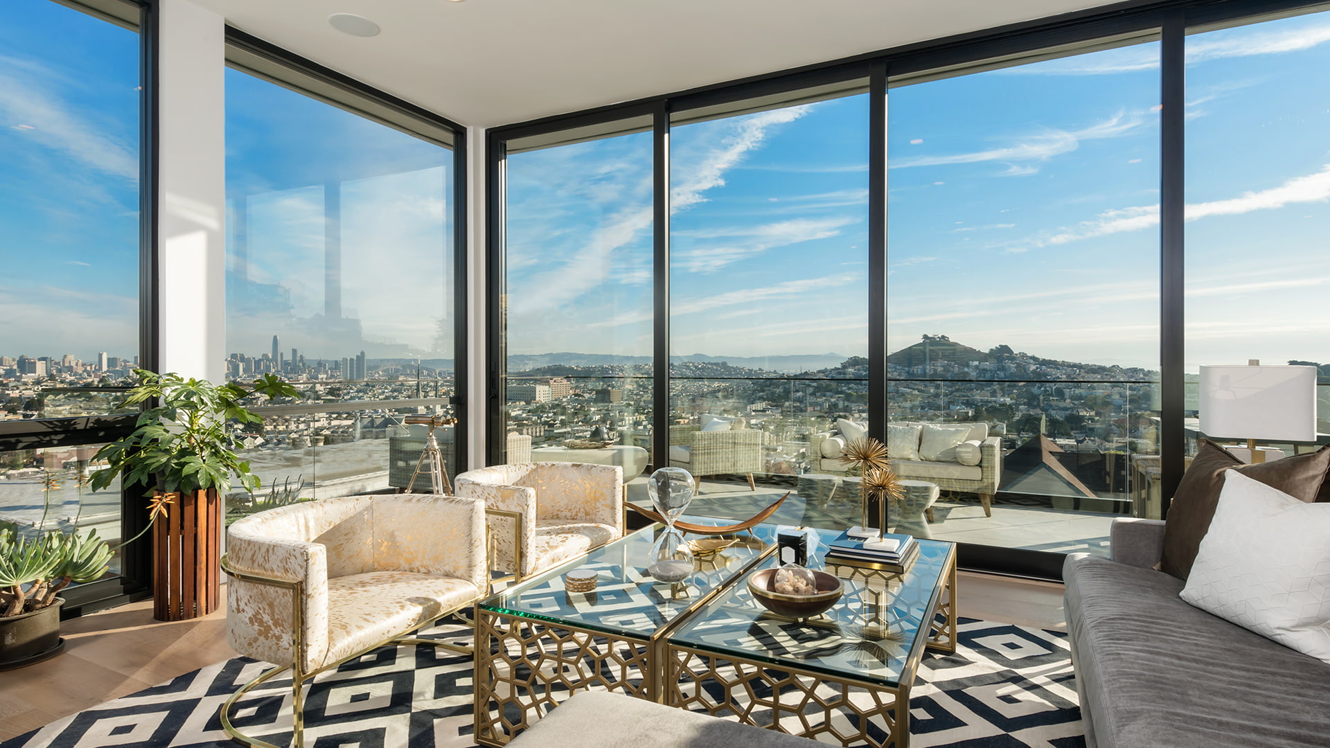 Penthouse view of the city skyline through full pocket doors