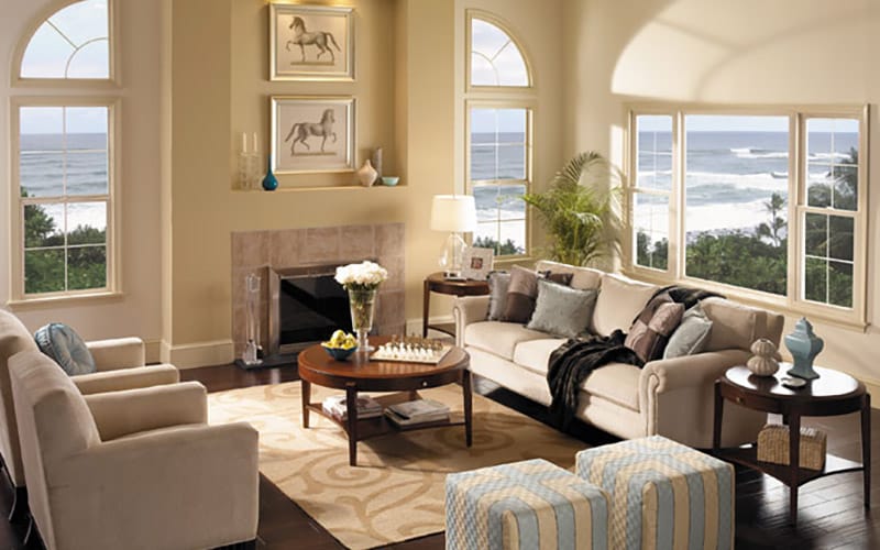 Traditional living room with single-hung windows and sliding patio door