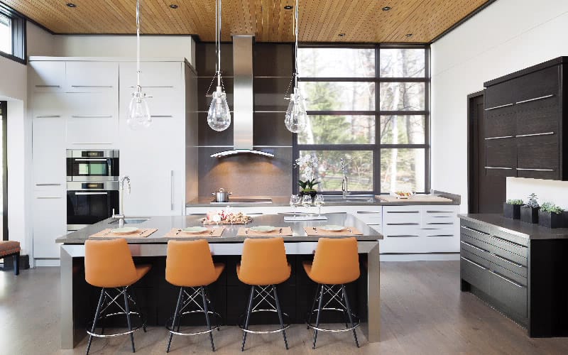 contemporary kitchen with orange-backed barstools