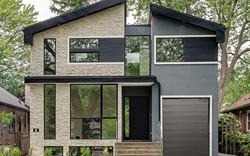 the outside of an ultra-contemporary home that has two very different exterior textures.