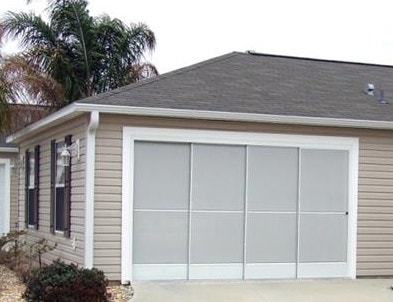 a garage door screen on a coastal home