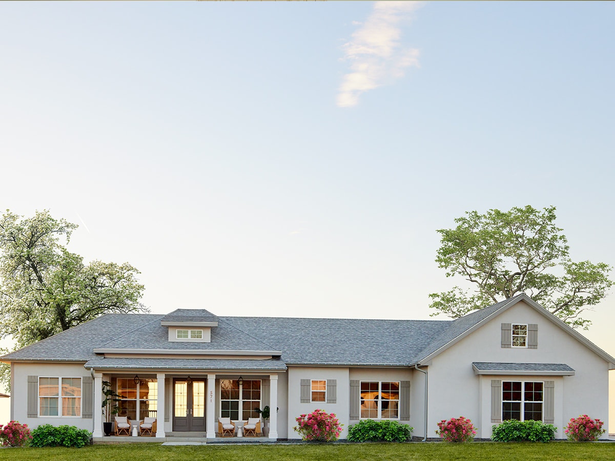 ranch-style home exterior with glass doors and single-hung windows