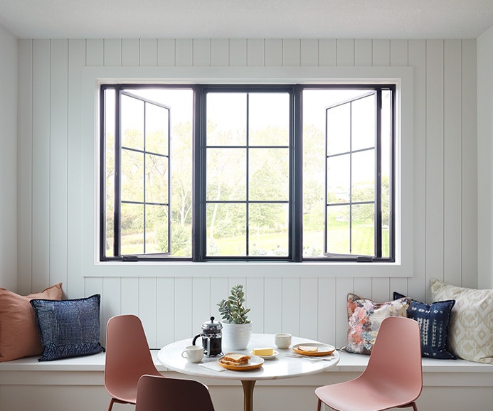 three casement windows with custom grilles