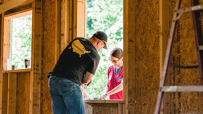 two people working on a home for Habitat for Humanity