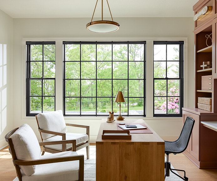 a traditional formal dining room chair in front of a white lifestyle series casement window