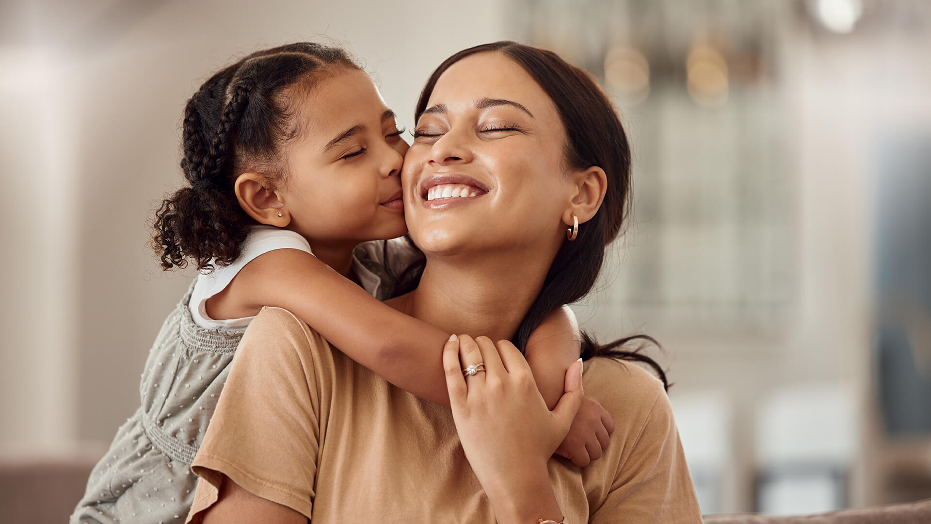 Daughter hugging her mother.