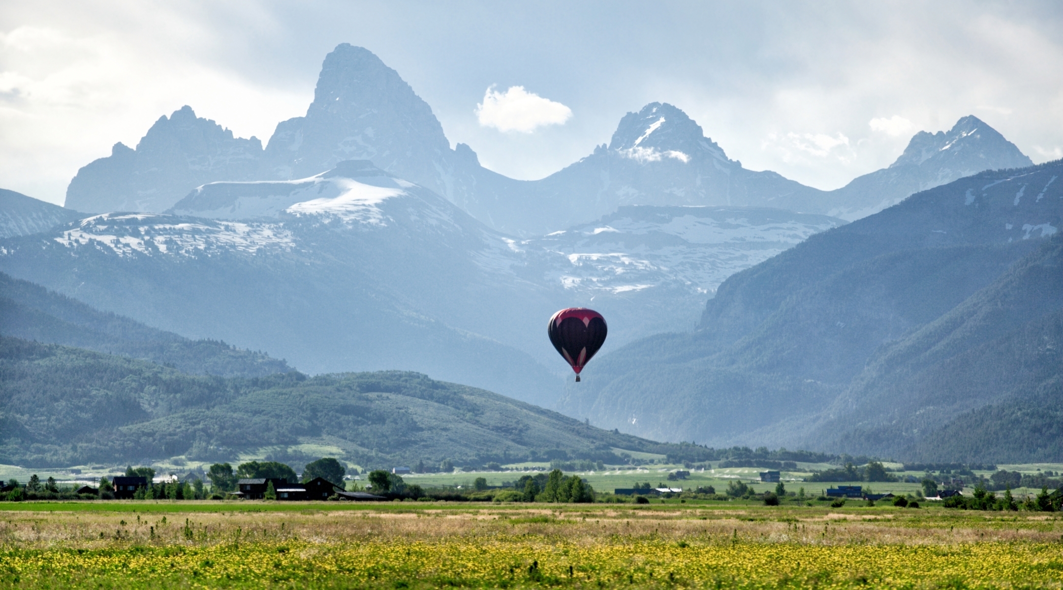 Mountains and a hot air balloon in a valley in Idaho