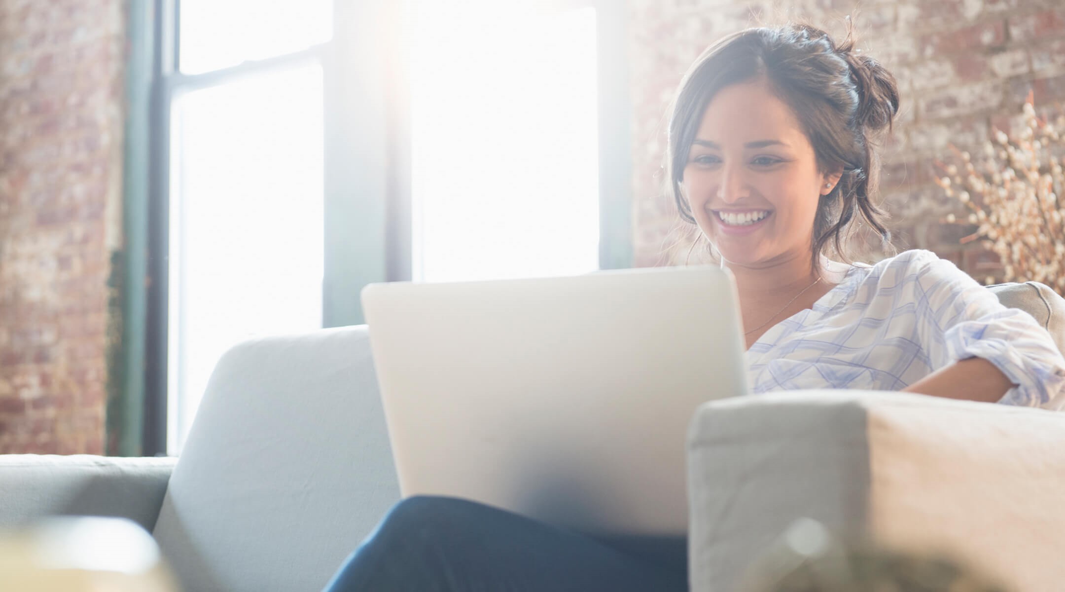 Woman smiling while on laptop
