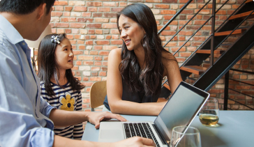 Family discussing privacy policy at a laptop