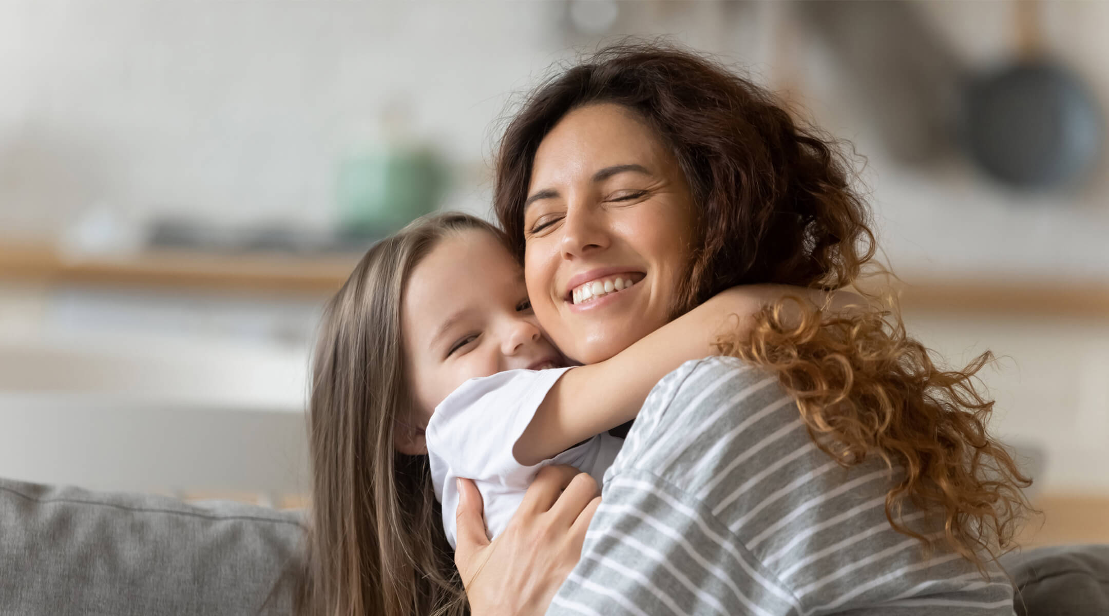 Mother hugging child