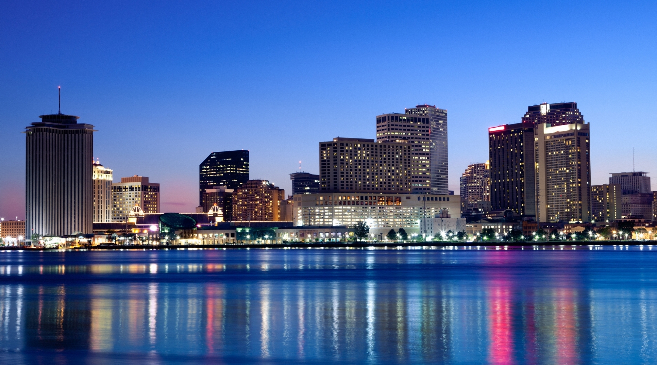 Evening view of downtown across a river in Louisiana