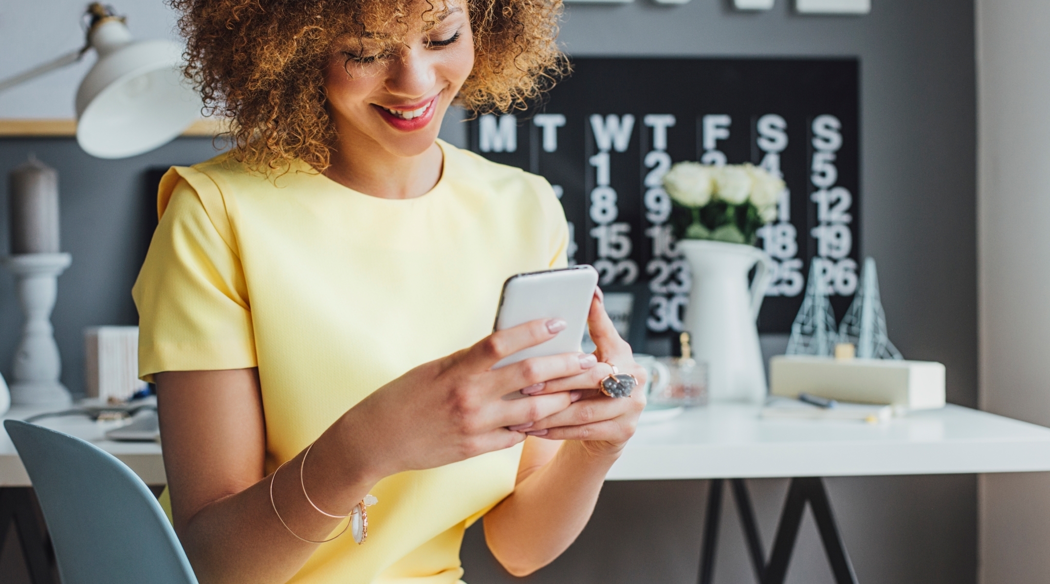 Person using a mobile phone to research cash loans