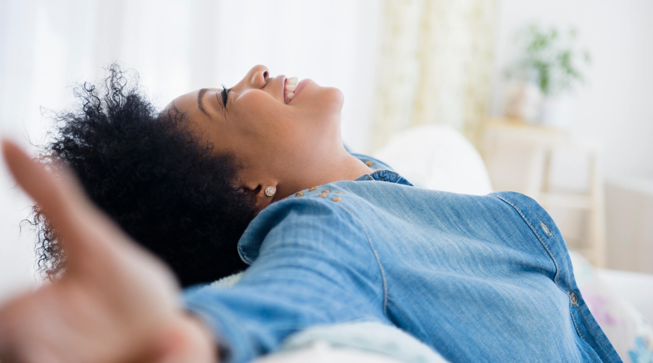 Woman laying back and smiling