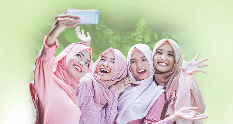 Group of young Malay women posing for a photograph 